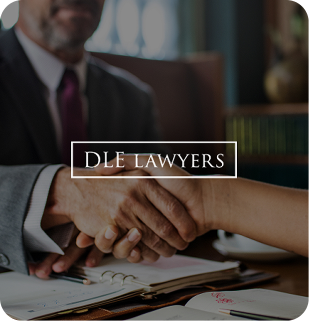 Person making a deal with their lawyer and giving eachother a handshake