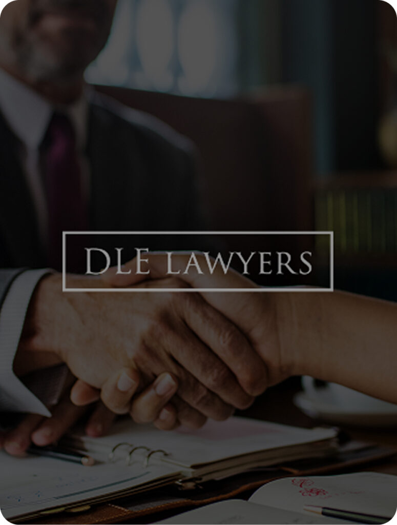 Person making a deal with their lawyer and giving eachother a handshake