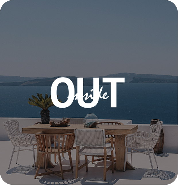 View to the ocean from a balcony with a dinner table