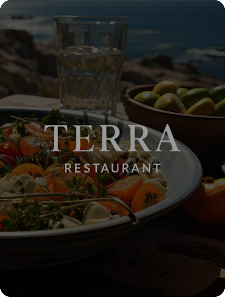 Table with a variety of delicious food alongside a view to the sea