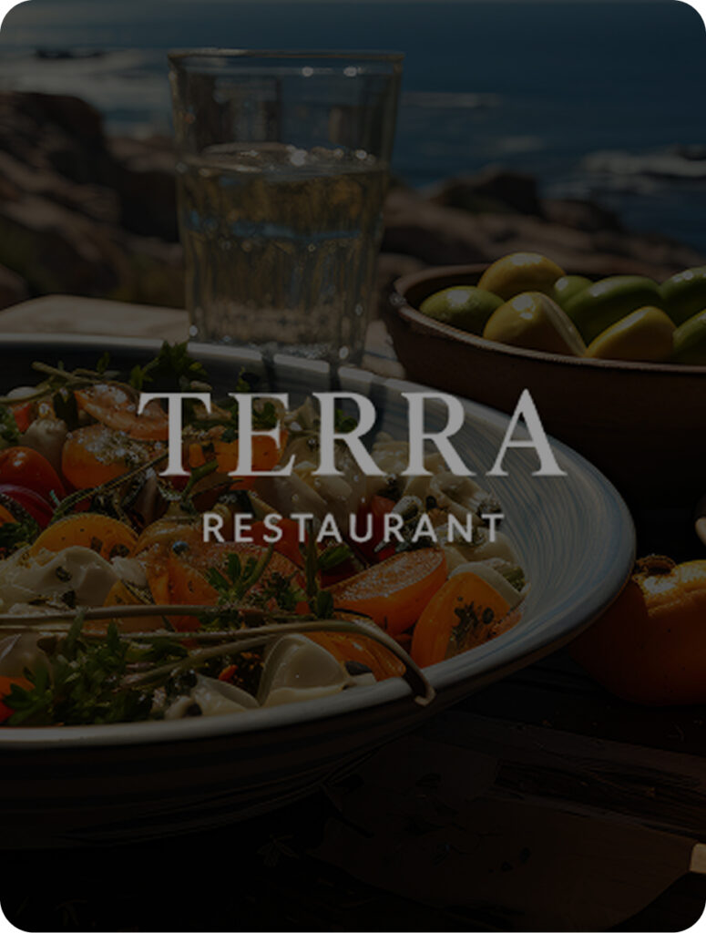 Table with a variety of delicious food alongside a view to the sea