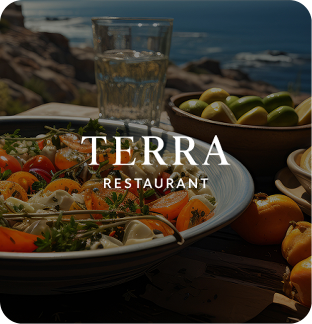 Table with a variety of delicious food alongside a view to the sea